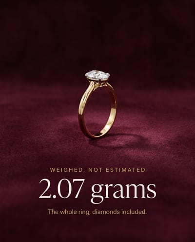 2.07 grams. The whole ring, diamonds included.

That is the Everlasting Halo in 14KT — 2.41 g if you take it in 18KT. A 